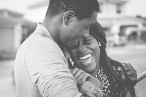 A young couple leans against each other smiling. They are happy with their decision to start black marriage counseling in Decatur, GA. Contact an online therapist in Decatur, GA with Faith and Family Empowerment. We offer relationship therapy in Atlanta, GA and a variety of services! 30030