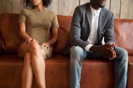 Shows a couple sitting on a couch unhappily. Symbolizes how marriage counseling in decatur, ga will help you and your spouse work on your marital issues.