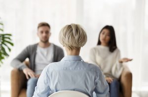 Shows a couple talking with a couples therapist in atlanta, ga. Symbolizes how marriage counseling in decatur, ga will help you in this relationship or future ones by helping you find healthier ways to communicate.