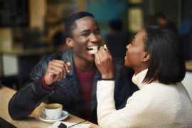 Shows a couple eating. Represents how marriage counseling in atlanta, ga and the intensives can benefit couples by working through issues that are plaguing the relationship.
