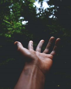 Shows a hand reaching to the sky. Represents how pastoral counseling in atlanta, ga helps individuals grow their spirituality and better their well-being.