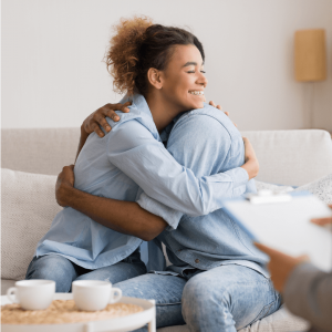 Shows a couple hugging in atlanta christian marriage counseling. Represents how christian counseling in atlanta, ga can give you tips to make your marriage successful.