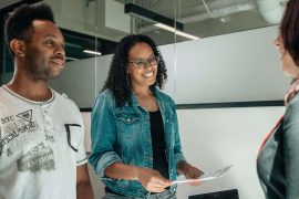 Shows a couple talking to their marriage counselor in Atlanta, GA while sitting on a couch. Represents how relationship counseling in Atlanta, GA can help couples learn how to communicate more effectively.