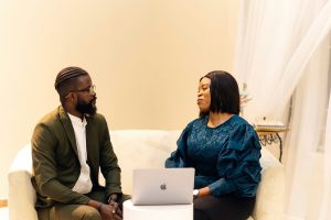 A Black couple engages in an honest therapy session, representing the support available through premarital counseling in atlanta, ga and spiritual trauma therapy in atlanta, ga.